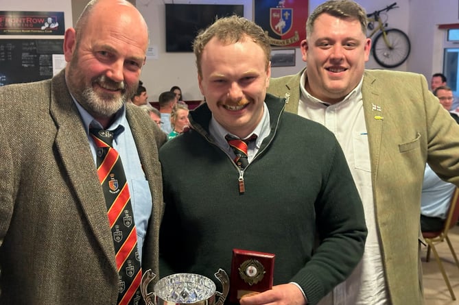 Moorlanders' 'unsung hero' Jonny Harris with his prize