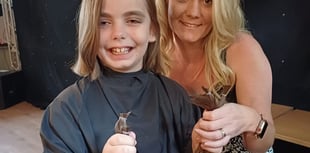 Girl donates long locks in pub fundraiser