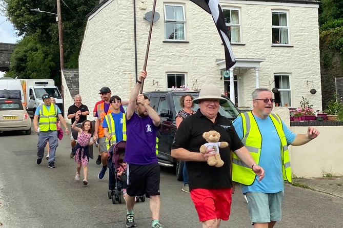 The walkers take their final strides towards Cotehele Lodge in  Calstock