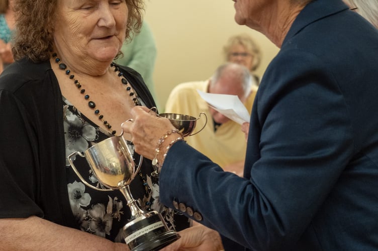 Angela Dawe being presented with her cup