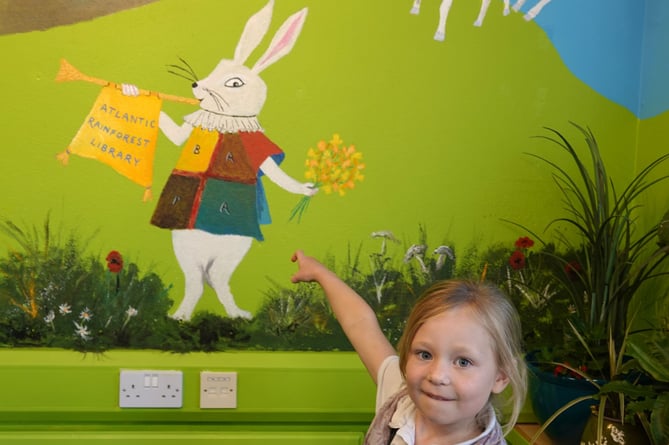 Little Linda Medhurst discovers the White Rabbit in the Atlantic Rainforest Library