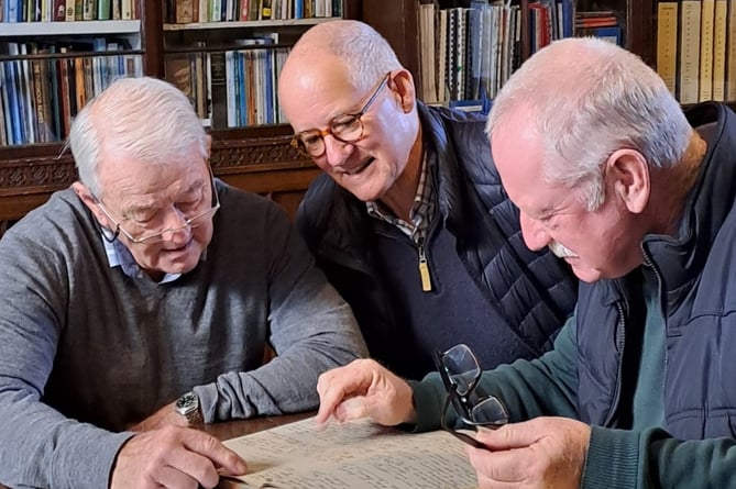 L to R Ian Parker and David Dance, chairman and treasurer respectively of The Tavy Walkham and Plym Fishing Club, with Simon Dell, chairman of Tavistock Subscription Library jpg