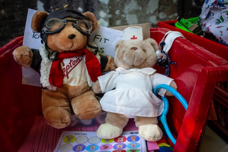 Brave teddies prepare to abseil at All Saints' Church, Okehampton