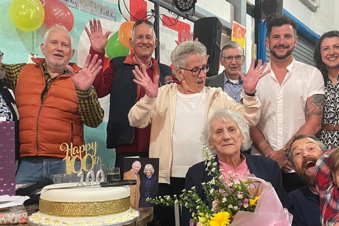 Gwen Shearer's (seated) family celebrate her hundredth birthday