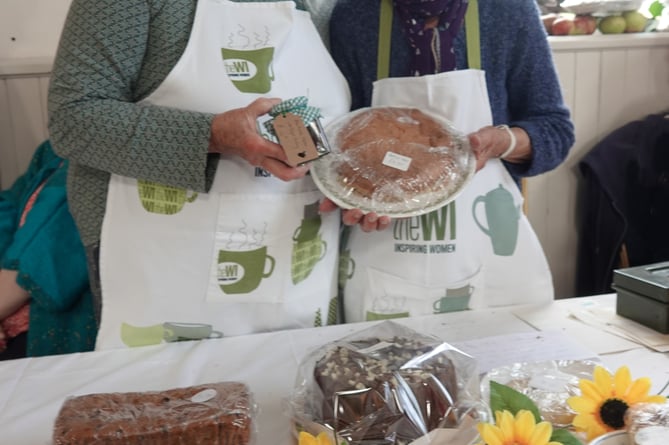 WI members Julia le Vasseur and Madeleine Smith with the group's homemade fare