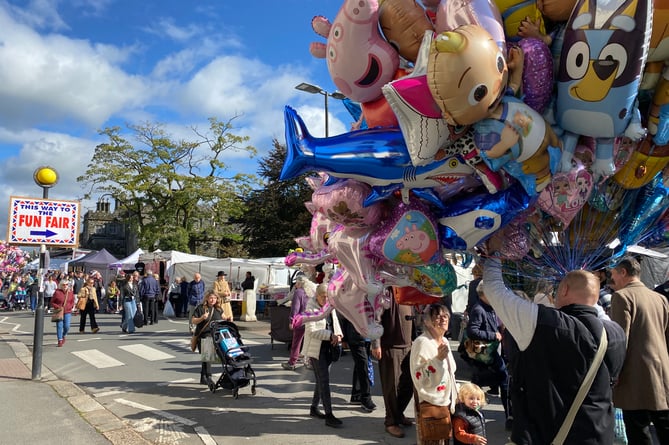 Tavistock Goose Fair balloon seller on crowded streets