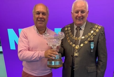 Tavistock Musical Theatre Company director Julian Bennett accepts a trophy for the 'best large programme' from NODA (National Operatic and Dramatic Association) president Graham Liverton at NODA's conference in Plymouth 