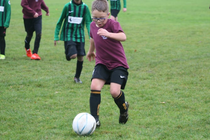 Close ball control a Tavistock schools' football competition.