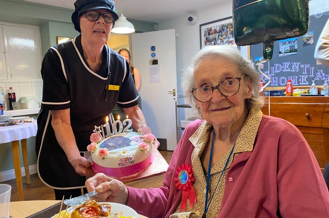 Iris Webb enjoys her 102nd birthday with a cake made by cook XX at Yelverton Residential Home JPG