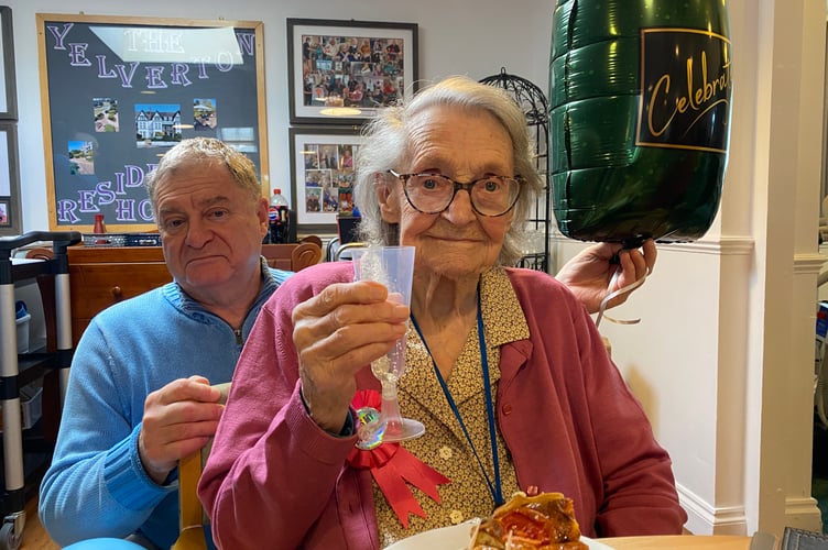 Iris Webb and her son Martin toast her 102nd birthday in Yelverton