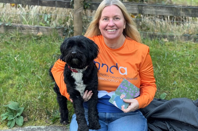 Emma Curran and co-walker Annie the Tibetan Terrier Annie with a photo of her dad James Friend who died of Motor Neurone Disease and is walking to raise funds for the Motor Neurone Disease Association. 