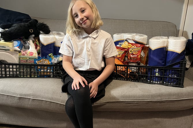 Aubree-Ena with the donations to Tavistock food bank