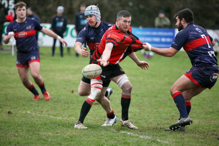 Tavistock RFC player coach Martin Budden has his shirt pulled