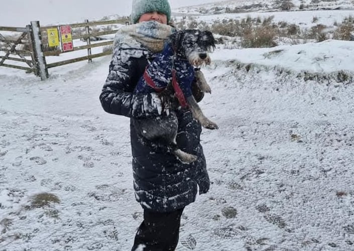 Nadine Lamb with her pooch enjoying the snow.