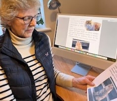 Karen Dreher and the missing cat poster of her beloved pet Finlay.