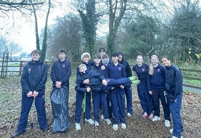 Community-minded teenagers of Mount Kelly College, Tavistock, clearing litter from Yelverton Play Park.