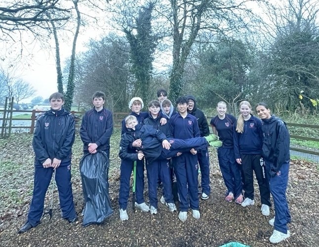 Community-minded teenagers of Mount Kelly College, Tavistock, clearing litter from Yelverton Play Park.