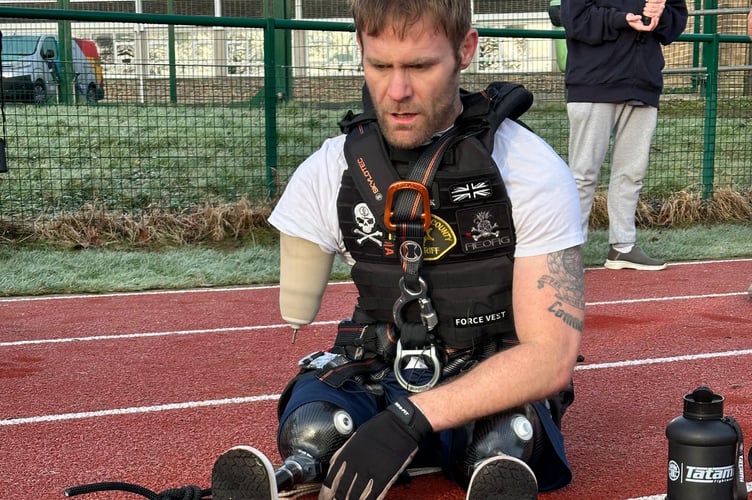 Amputee Mark Ormrod recovering after pulling a heavy vehicle along a running track in Tavistock.