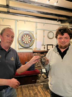 Tom Hughes (right) receiving the trophy from Mark Watson