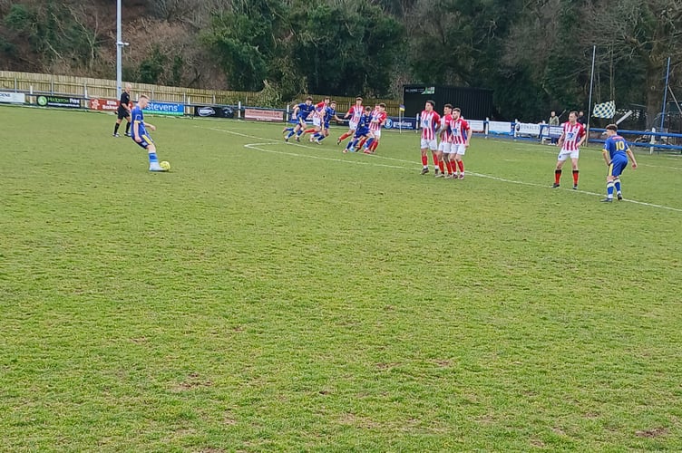 Josh Coles with an Okehampton Argyle free kick in the first half