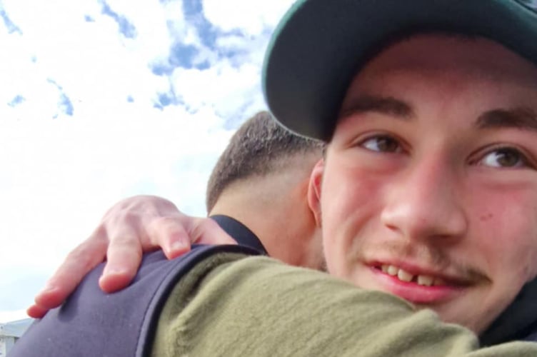 United in loss - Plymouth Argyle manager Miron Muslic and fan Damien Bowyer, 17, from Tavistock, share a hug at Home Park.