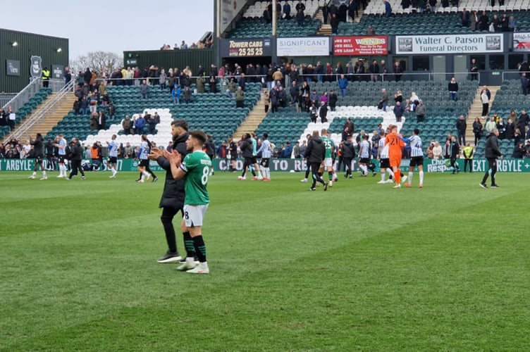 Argyle manager Miron Muslic and his players thank the remaining home fans after a Home Park defeat by Sheffield Wednesday led to many leaving at half-time. 