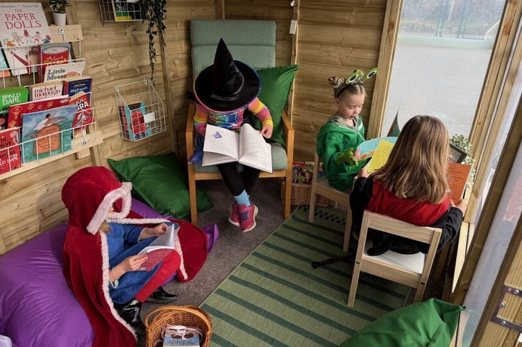 Bridestowe School  pupils enjoying their new reading shed.