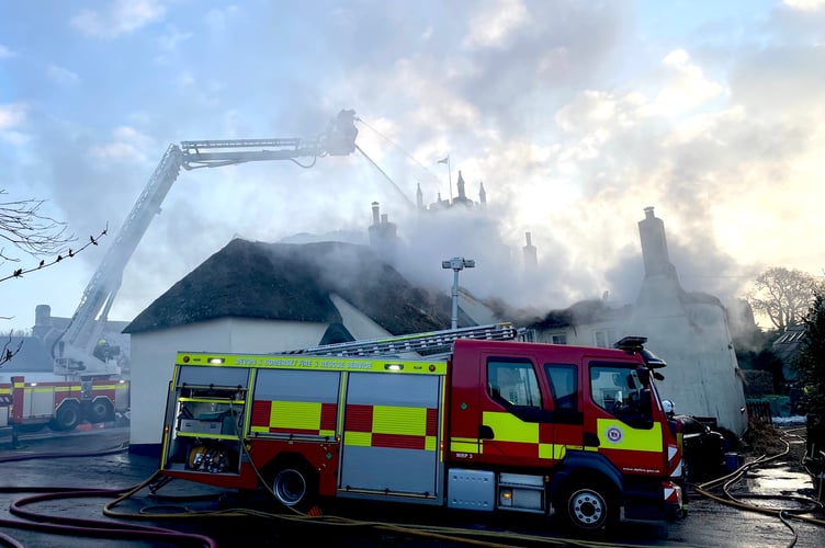 Firecrews at the scene of the thatched property fire in Drewsteignton.
Photo:  The Drewe Arms Community Pub/Facebook