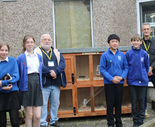 Men in Sheds build primary school children a hutch